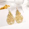 Pendientes de Metal Calado Transfronterizos de Hoja Multicapa Retro Étnicos Feng Shui Colgante de Disco Geométrico con Borlas Venta al por Mayor