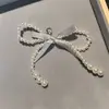 Zapatos de ballet del mismo estilo de Jennie con cadena de lazo de perla en forma de corazón plateado hebilla de zapato con letra DIY cierre de flor