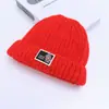 Gorro de invierno nuevo para niños transfronterizo, gorro de punto grueso para otoño e invierno, diseño lindo de parche de oso, gorro de lana para niños al por mayor