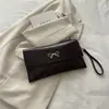 Bolso casual de moda estilo retro para mujer, nuevo bolso de mano de otoño 2026, bolso cuadrado pequeño versátil, bolso de mano de nicho versión coreana