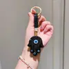 Llavero Mano de Fátima Ojos Azules Llavero Ojo del Diablo con Pedrería Colgante Pedrería Brillante Decoración de Coche