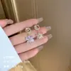 Exquisitos pendientes largos cortos con borlas incrustados de perlas y diamantes para mujer diseño de nicho de lujo ligero pendientes de lazo amor