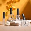 Em estoque Fornecimento de esmalte de unha Frasco de vidro Frasco quadrado 8ml10ml Frasco de pincel Tampa preta Óleo nutricional transparente Frasco de vidro