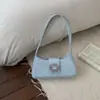 Bolso único de lunares de nicho para mujer, nueva moda 2026, bolso versátil para el hombro o debajo del brazo para ir al trabajo, bolso de mano pequeño para salir