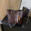 Bolso de Mano Retro de Gran Capacidad para Nicho Transfronterizo Bolso Tote para el Hombro para Mujer Nueva Moda Otoño e Invierno 2026 Bolso de Hombro Versátil