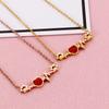Collar de acero de titanio con forma de pata de gato japonesa y coreana con diseño de diamante rojo y cadena de clavícula sencilla de moda de este año Accesorios al por mayor