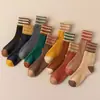 Nuevos Calcetines de Otoño e Invierno para Hombres y Mujeres Calcetines Gruesos Cálidos con Forro de Felpa Japonés calcetines de toalla de piso de tres rayas de rizo calcetines de tubo medio