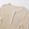 Ins ropa de mujer al por mayor estilo europeo y americano transfronterizo otoño nuevo elegante top de punto con botones para ir al trabajo 8779623