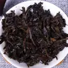 Pastel de té Pu'er al por mayor Té Pu'er té cocido 357G Pastel cocido Banzhang Yema dorada Pastel de siete semillas de Yunnan Té Negro