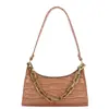 Bolsa de mano tipo dumpling de alta calidad al por mayor para mujer, nuevo modelo otoño 2026, bolso de hombro de color liso con patrón de cocodrilo, bolso de axila de moda