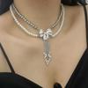 Collar de perlas de doble capa con diseño de nicho europeo y americano, estilo socialité de alta gama, con borlas y cadena de clavícula para mujer.