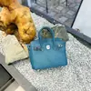 Bolso de mano de cuero platino con patrón de lichi, bolso tipo Kelly de gran capacidad para mujer, nuevo bolso de hombro de moda 2026