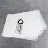 Fabricante de bolsas autoadhesivas degradables suministra bolsas autosellables biodegradables de PLA, bolsas ecológicas para empaque de ropa, disponibles para impresión y personalización