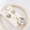 Nuevo especial transfronterizo explosión de tendencia europea y americana titanio acero alta calidad color collar pendientes traje femenino joyería de concha real