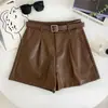 Shorts de couro PU femininos 2026 outono e inverno novo design senso retrô versátil cintura alta modelador peça externa calça de bota com cinto