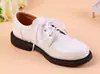 Zapatos de cuero para niños de primavera y otoño con correa en blanco y negro, zapatos de estudiante británicos, zapatos de reloj para niños, zapatos deportivos grandes para niños