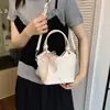 Comercio Exterior Bolsos de Mujer de Nicho 2026 Nueva Moda Súper Populares Bolso de Hombro para Viajes al Trabajo Bolso Cruzado de Cubo de Alta Gama