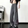 Pantalones de chándal de retazos a rayas para hombre, pantalones casuales holgados de peso pesado retro de otoño, pantalones deportivos juveniles de pierna recta ancha de moda