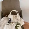 Bolsa de Ombro e Transversal Feminina 2026 Outono Nova Simples Versátil Texturizada para o Dia a Dia, Estilo Coreano de Nicho, Luxo Leve, Transfronteiriça
