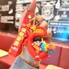 Moda nacional de dibujos animados Año del Dragón Xingshi gran amuleto llavero lindo adornos para bolso de pareja pequeño regalo de Año Nuevo al por mayor