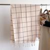 Bufanda chal cálida de cachemira a cuadros de estilo coreano de celebridades de Internet, bufanda unisex de moda de otoño e invierno con borlas que combinan con todo.