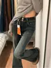 Jeans Americanos de Tiro Bajo Elásticos Micro-Acampanados 2026 Primavera Azul-Gris Diseño de Doble Botonadura Pantalones Micro-Acampanados de Largo hasta el Suelo