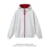 Sudadera con capucha y cremallera de bloques de color especial Otoño 2026 para Hombres y Mujeres Marca de Moda Holgada para Pareja Casual Versátil Chaqueta con Capucha