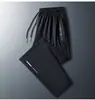 Calças Casuais de Seda Gelo Masculinas Verão Secagem Rápida Calças para Ar Condicionado Calças Retas Soltas Calças Esportivas de Alta Elasticidade Leggings de Cor Sólida