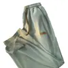 Pantalones elásticos frescos de seda de hielo contra-retirada orden de cola fuga-recogida productos genuinos marca grande comercio exterior etiqueta cortada estilo Hong Kong retro rectos