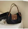 Bolsa de Ombro Grande de Uso Casual para Mulheres 2025 Nova Costura em Cor Contrastante Bolsa de Mão Tecido de Nylon Bolsa Tote Tendência