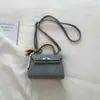 2026 Nueva Moda Trendy Bolso con Hebilla de Cierre Texturizada Estilo Ins Bolso Pequeño Cuadrado para Mujer Primavera y Verano Bolso Cruzado Artístico Elegante