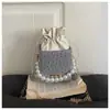Bolso minimalista de nicho de alto valor para mujer, bolso tipo caja, otoño 2026, nuevo, moderno, con textura, cadena, perla, de un solo hombro, cruzado
