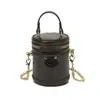 Bolso de hombro brillante tipo coreano con láser para niños y niñas, mini bolso cubo compacto para bebé 2026, bolso de cadena para niños padres-hijos