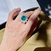 Anillo de dedo de imitación de esmeralda y girasol para mujer, de lujo, con diamantes y flor verde Paraiba, muy popular en verano.