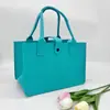 Bolso de fieltro en stock al por mayor personalizado con hebilla bolsa de fieltro de alta calidad bolsa de regalo corporativo regalo de mano bolsa tote