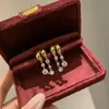 Pendientes de Borla Explosiva con Perforaciones de Burbujas de Caperucita Roja Moda Alto Valor de Color Diseño de Moda Lujo Ligero Personalizado Joyería Versátil para Mujer