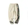 Otoño e invierno 2024 nuevo pantalón de algodón chino para hombre de comercio exterior moda vintage talla grande bordado pantalón deportivo