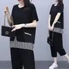 Nuevo traje de verano para mujer talla grande Adelgazante Holgado Moda Elegante Rayas Camiseta de manga corta Pantalones de nueve cuartos Conjunto de dos piezas