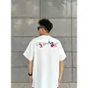 Camiseta de Algodão Puro com Bordado Floral na Frente e nas Costas, Manga Curta para Homens e Mulheres, Verão, Caimento Solto, Versátil, Estilo Americano, Gola Redonda, Manga Meia