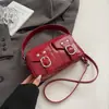 Bolso de Mano Compacto de Moda y Estilo Coreano 2026 Primavera Nuevo Bolso Cruzado de Motocicleta Simple y Único para Mujer