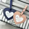 Etiqueta de equipaje con forma de corazón de cuero PU colorido en stock transfronterizo, etiqueta de equipaje simple anti-pérdida, etiqueta de facturación