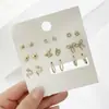Juego de Pendientes de Flor de Perla Hoja Estrella de Cinco Puntas Mariposa Nueve Pares Estilo Ins Europeo y Americano Pendientes de Celebridad de Internet Pendientes