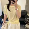 Top de punto de manga corta con diseño floral tridimensional estilo coreano para mujer, nuevo diseño fino de verano 2026, top tipo camiseta holgado, estilo Ins
