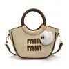 Bolsa Europeia e Americana Feminina 2025 Nova de Alta Qualidade Nicho Textura Bordada Bolsa de Ombro Transversal Bolsa de Balde Portátil Feminina