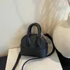 Shuai Mijia 2026 Verano Nueva Moda Elegante Mini Retro Simple y Único Bolso de Hombro Cruzado de Mano Bolso con Forma de Concha