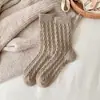 Meias femininas de outono e inverno novas grossas quentes de cano alto cor sólida torcidas vintage meias versáteis casuais para o chão meias da lua