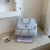 Mochila Pequena Acolchoada com Corrente Estilo Chanel 2026 Nova Coleção Primavera/Verão Bolsa de Mão Vintage Bolsa de Ombro Mochila Fashion e Única
