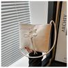 Bolso de Diseño de Nicho Bolso Cubo para Mujer Verano 2026 Nueva Moda Simple Dulce Lazo Bolso de Hombro para Debajo del Brazo
