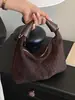 Bolso transfronterizo para mujer, bolso de hombro de moda y tendencia para el día a día, bolso de axila, bolso para lonchera, nuevo bolso tejido versátil y cómodo 2026