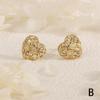 Joyería en forma de corazón Aretes de flor Aretes europeos y americanos transfronterizos de lujo ligero Cobre chapado en oro Zirconia Aretes de botón Nicho Sensación de alta gama